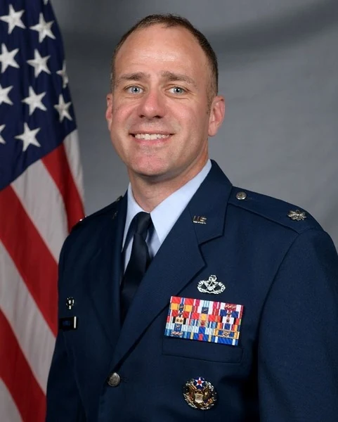 Official Air Force portrait of Colonel Ryan A. Howell in service dress.