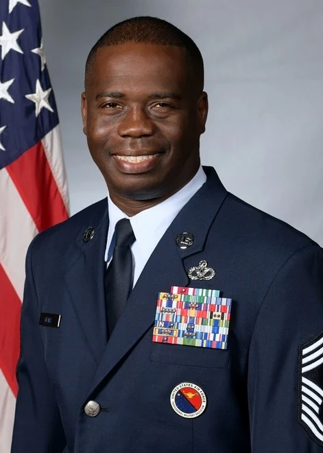 Official Air Force portrait of Chief Master Sergeant Justin J. Seals in service dress.